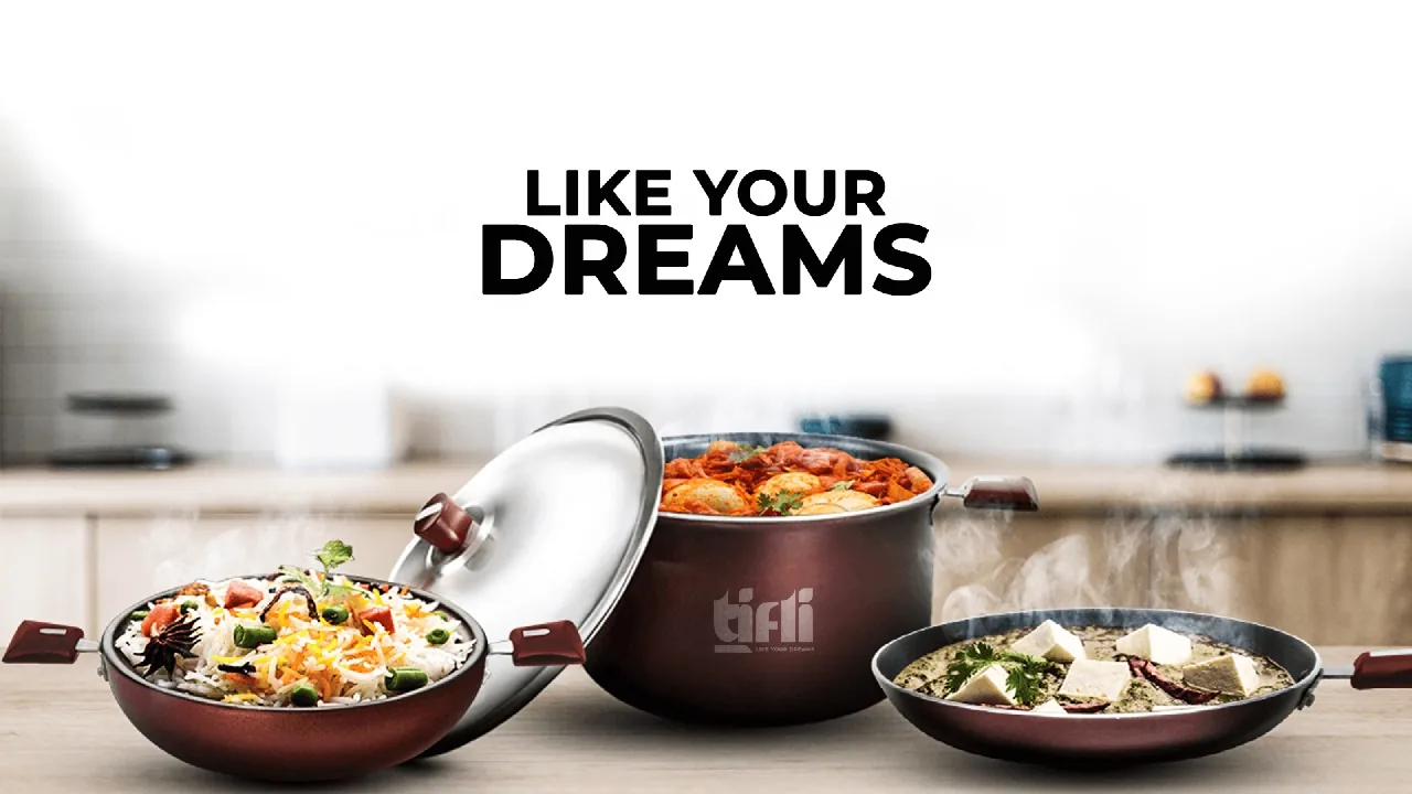 TIFLI kadhai, deep pot and fry pan serving biryani, curry and palak paneer on a kitchen counter