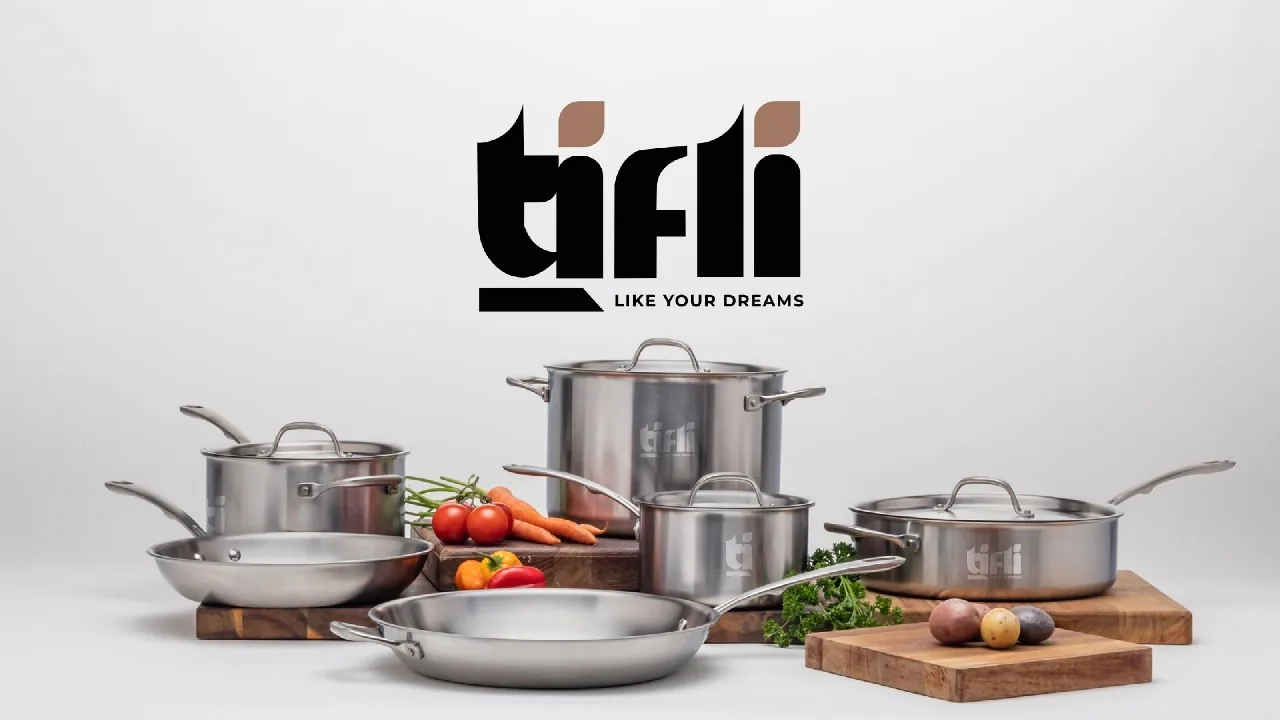 Complete TIFLI stainless steel cookware set with stock pot, saucepans and fry pans beside fresh vegetables